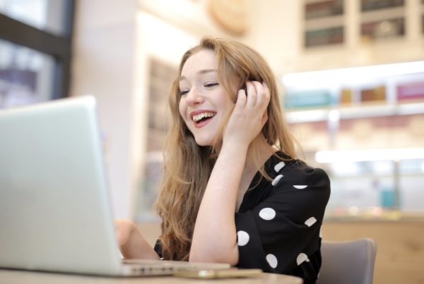 Woman Using Laptop to view accessible website