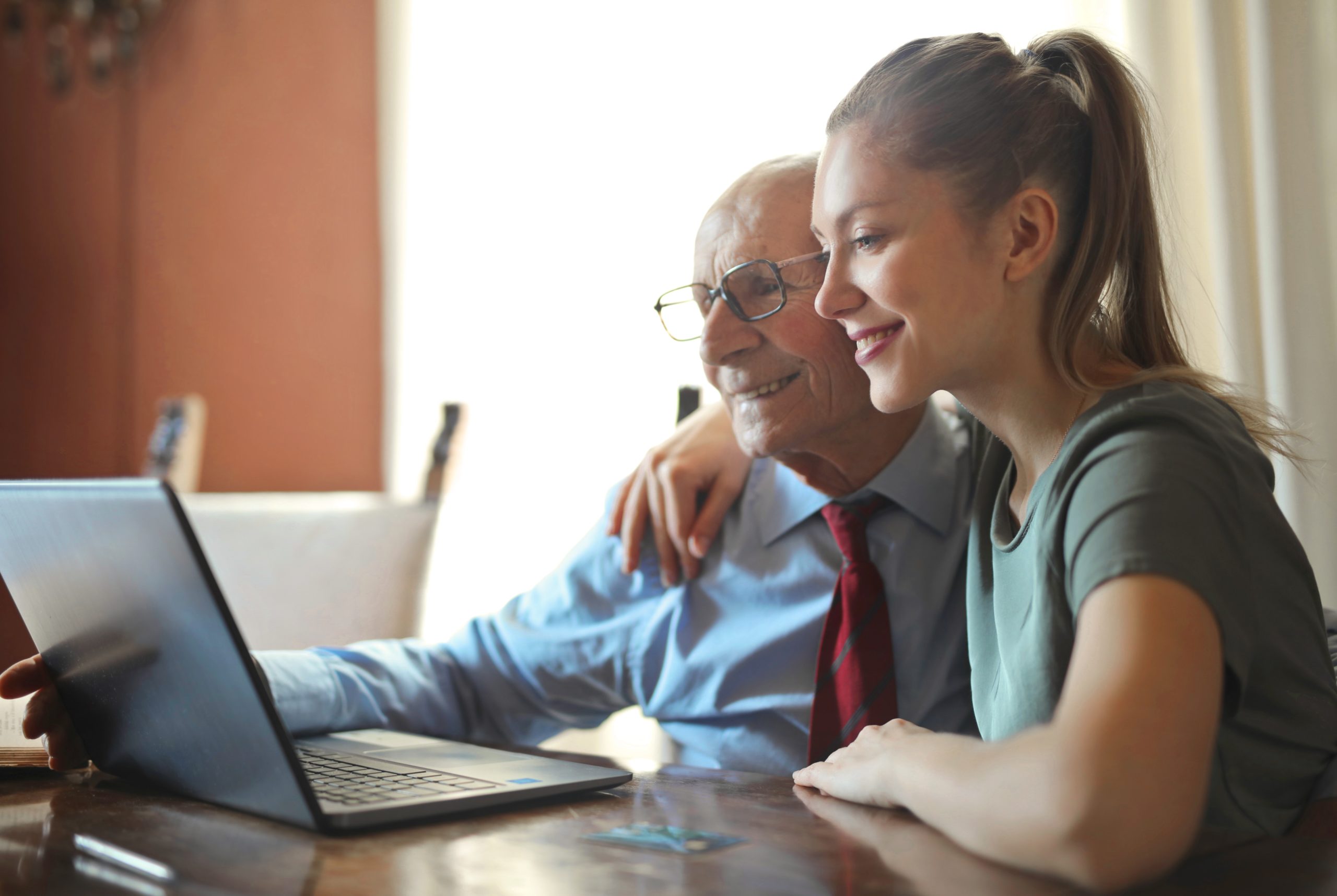 Woman and Man Using Laptop